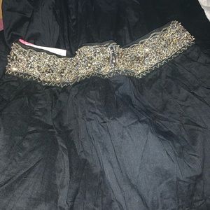 Long black womans skirt still has tags on it.